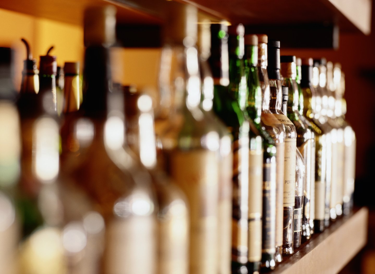 Shelf of liquor bottles (differential focus